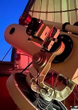 A piece of astronomy equipment aimed at the night sky.