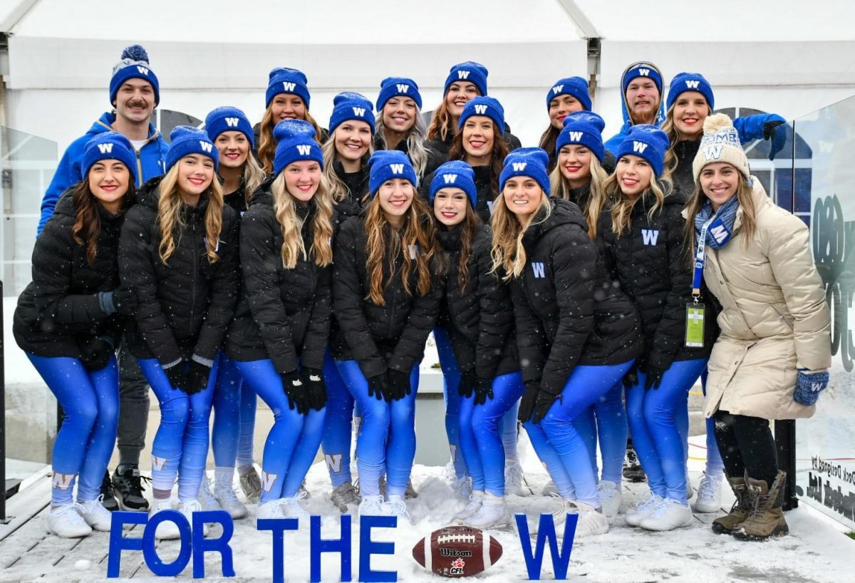 Blue Bombers Cheer and Dance Team 2022 Faculty of Law Research and Graduate Studies Assistant Lexa Moorehouse back-row middle (4th from left). Photo credit j.burzphotography