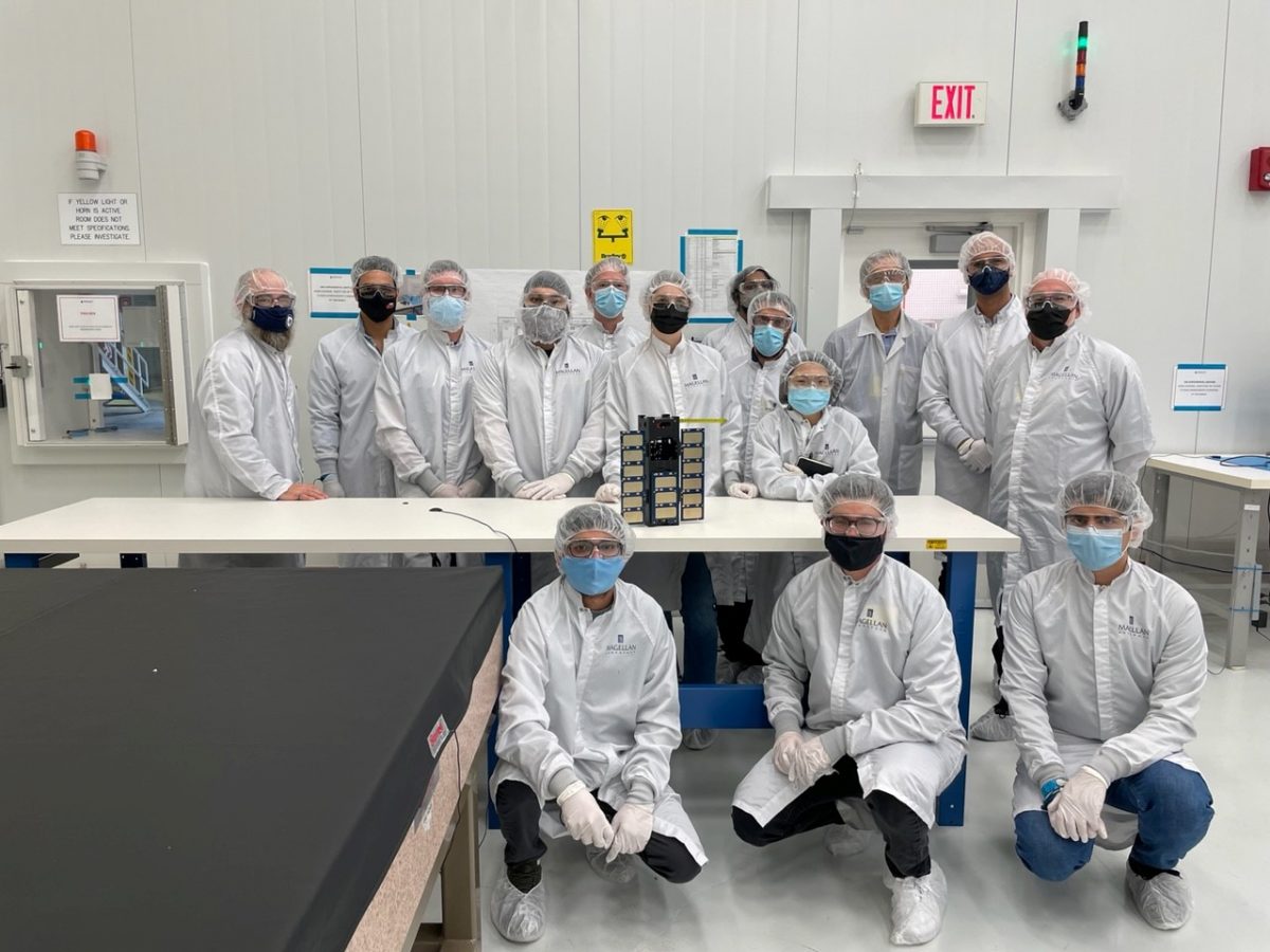 The UM STARlab team in the clean room at Magellan Aerospace with the UM satellite