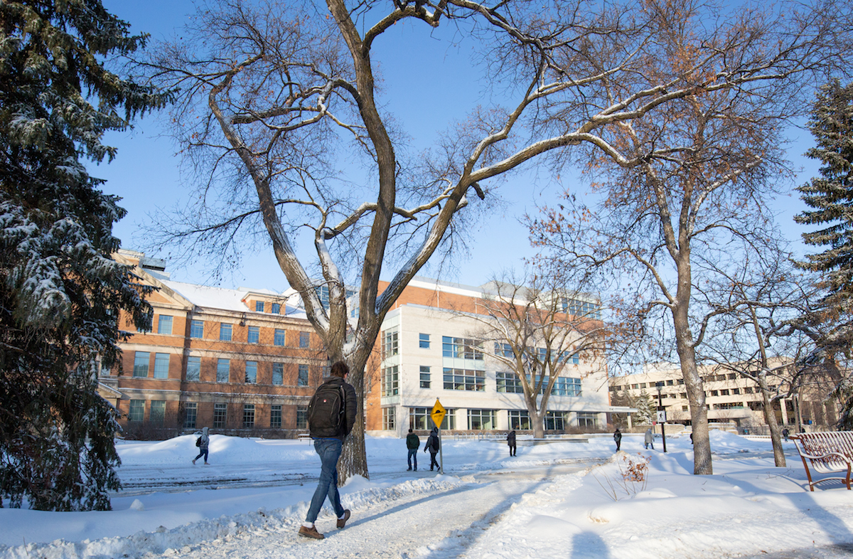 Winter, people walking outside the Tier Building at Fort Garry campus