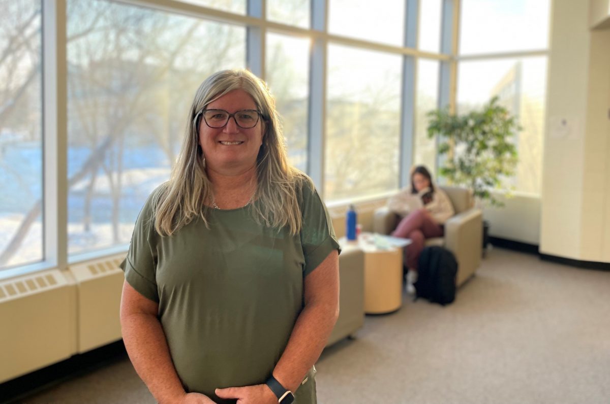 Kim Mitchell stands in the student lounge at the College of Nursing.