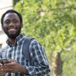 Black student holds phone at Fort Garry campus
