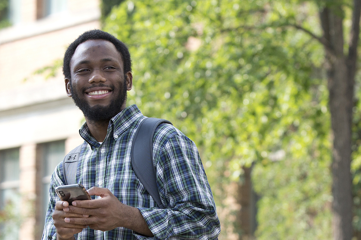 Black student holds phone at Fort Garry campus