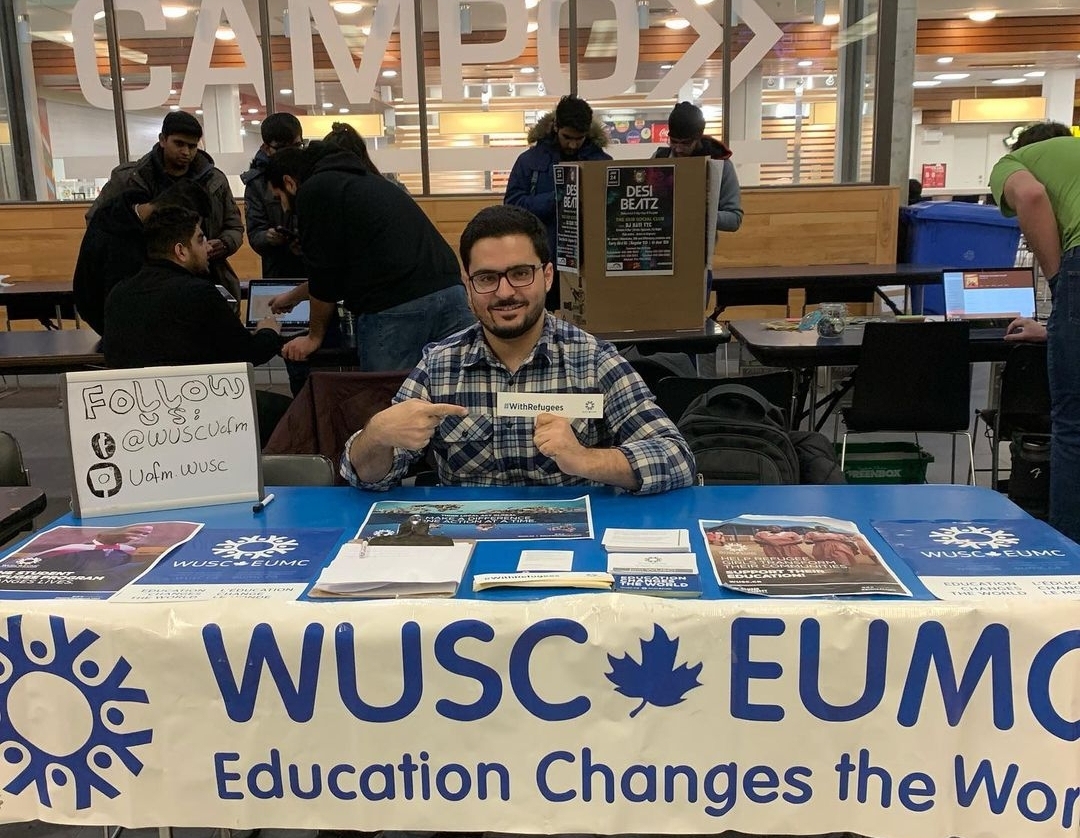 Man at WUSC recruitment booth.