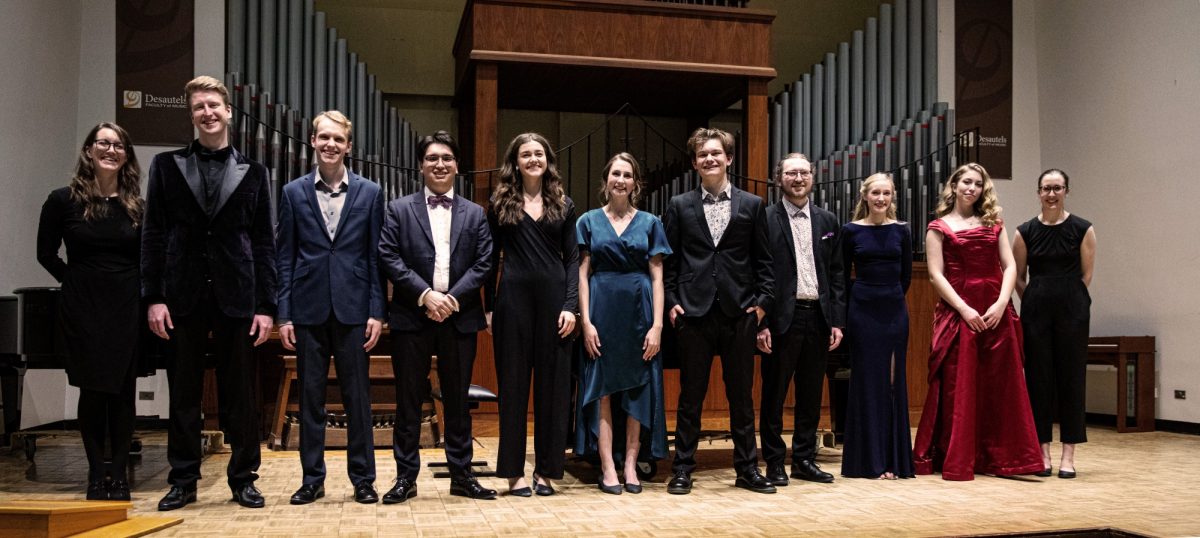 11 musicians standing on stage at the Zita Bernstein competition