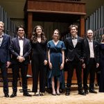11 musicians standing on stage at the Zita Bernstein competition
