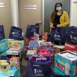 A room full of holiday basket with, children's toys and diapers.