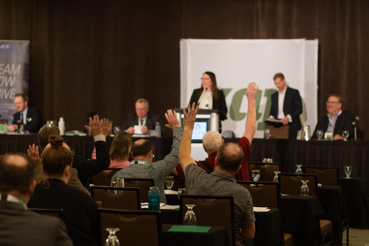 Members of Keystone Agricultural Producers raise their hands to vote