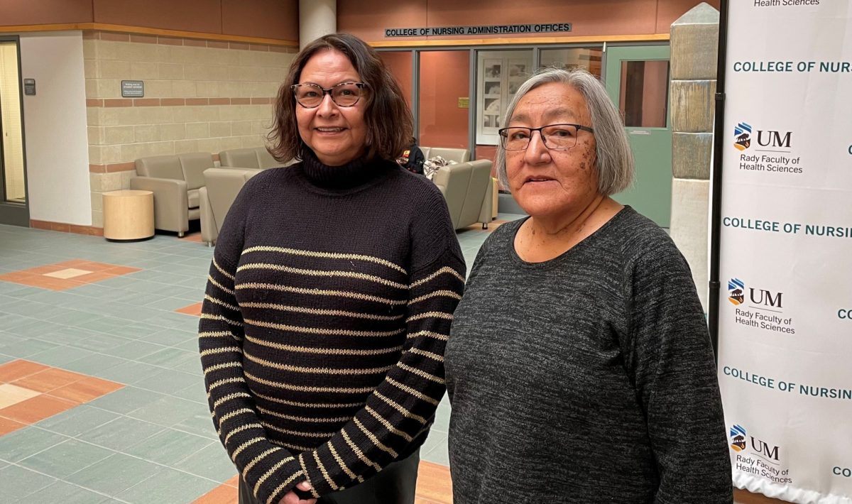 Brenda Longclaws and Linda Williams stand in the atrium of the Helen Glass Centre for Nursing.