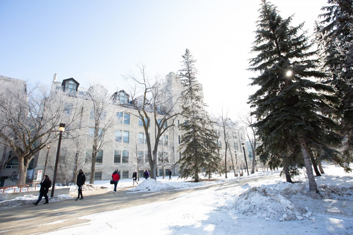 students walking outdoors on a sunny day in winter.