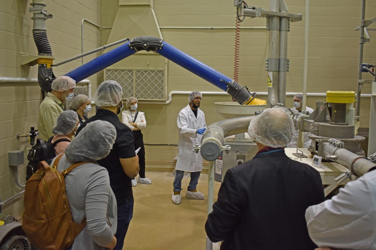 A technician demonstrates the milling and fractionation technology at the Richardson Centre for Food Technology and Research.