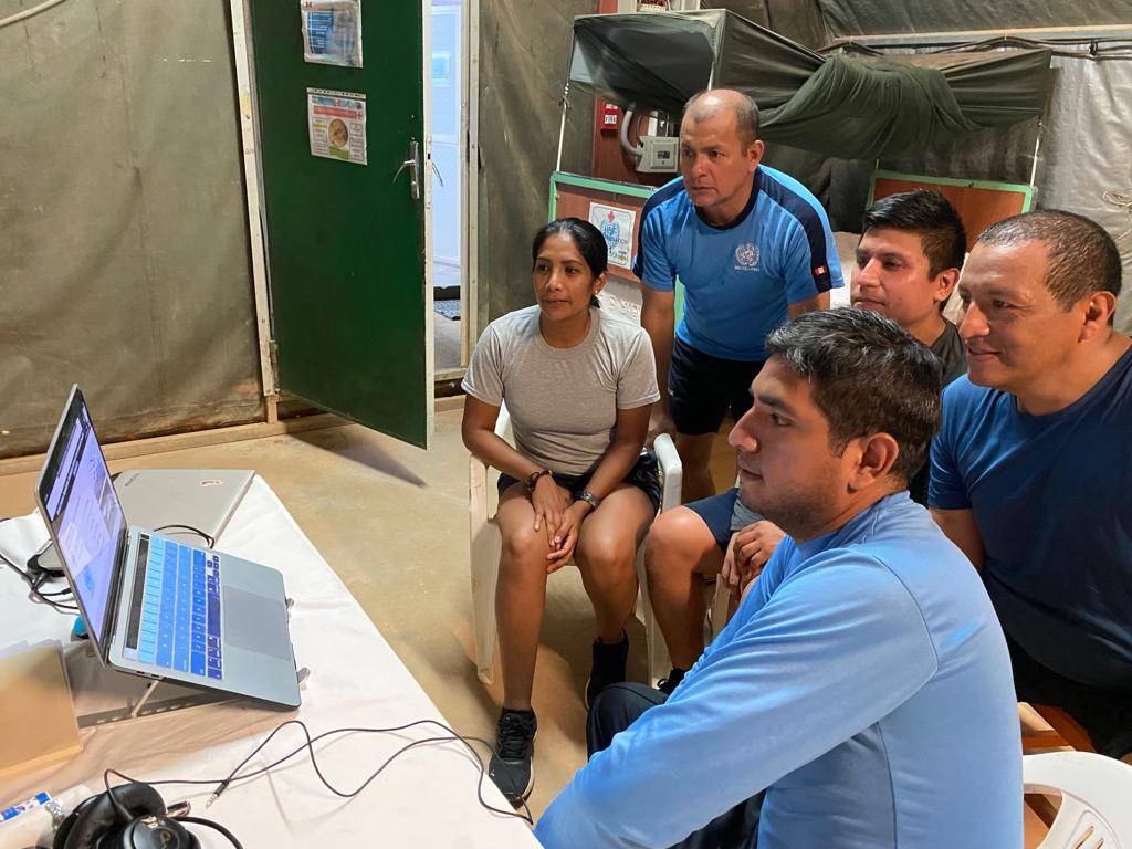 Tuning in online to a Brown Bag Lecture being held at St. Paul’s College, University of Manitoba in Winnipeg, are members of the Peruvian Military Engineering Company in the United Nations Multidimensional Integrated Stabilization Mission in the Central African Republic (MINUSCA), deployed in the Western Sector, Bouar, Central African Republic. Photo by Lt. Cdr. Gabriel Velarde.