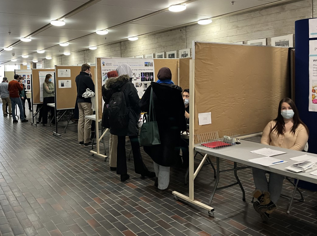 students visiting the grad studies open house info booths