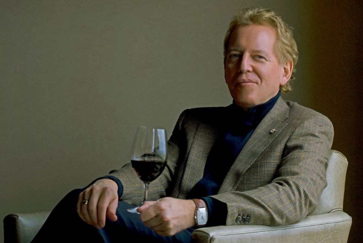 Man sitting with a glass of wine