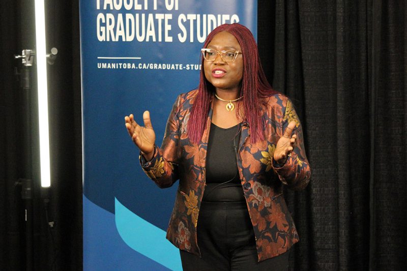 Dr. Olubukola Olatosi gives her presentation. A banner behind her reads "Faculty of Graduate Studies" and "umanitoba.ca/graduate-studies". 