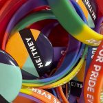 Pride bands and pronoun buttons