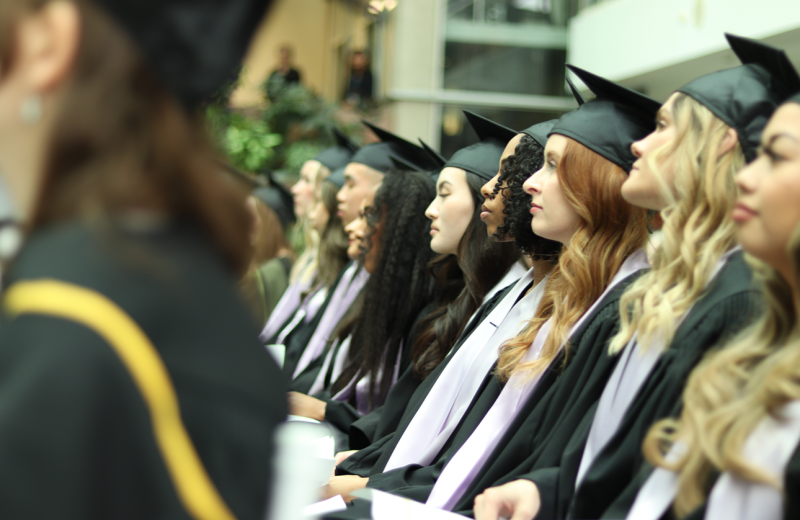 Dental hygiene students wearing cap and gowns at the convocation ceremony. 