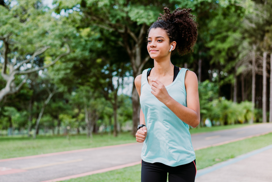 A teenager is jogging.