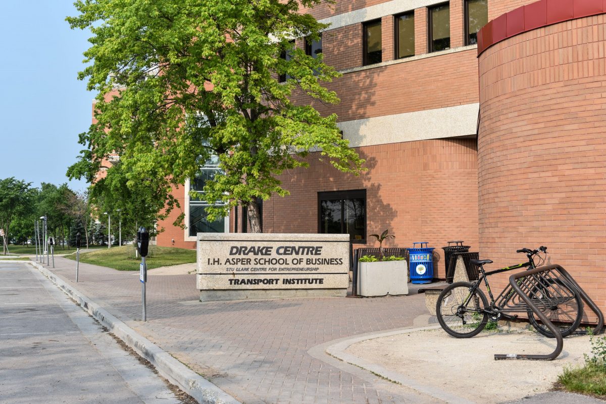 outside of drake centre featuring building sign and entryway
