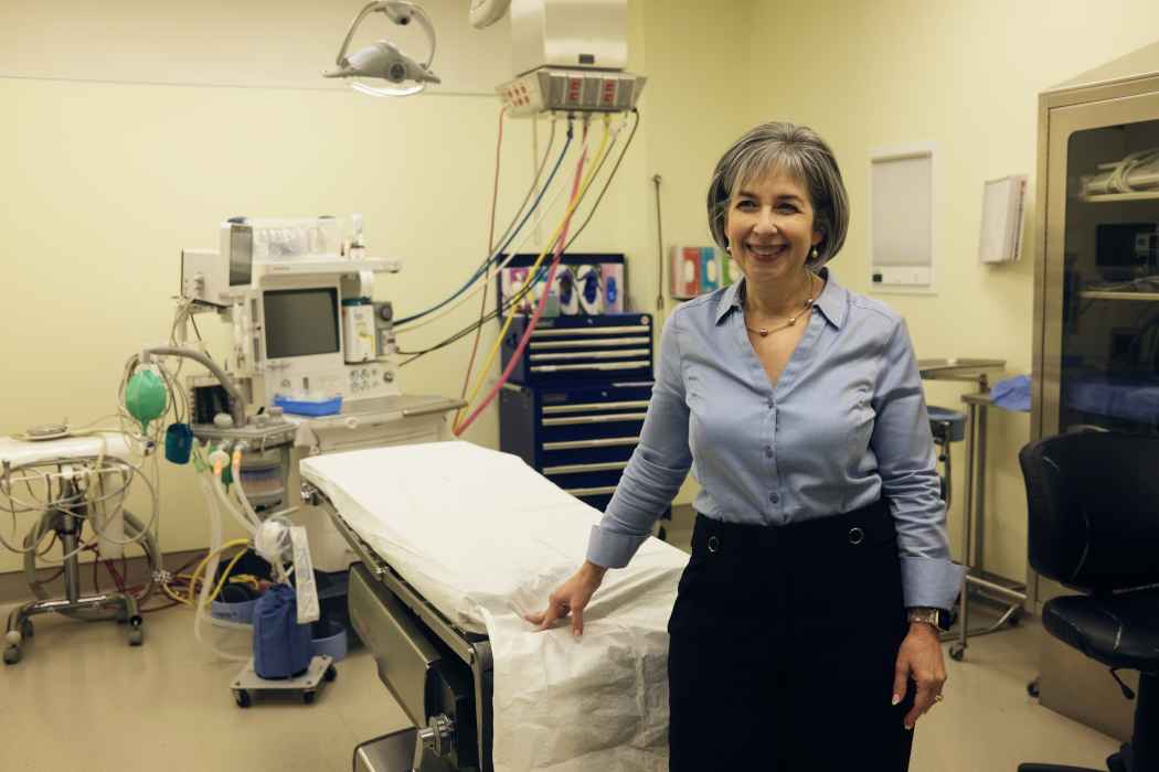 Dr. Carla Cohn stands in an operating room.