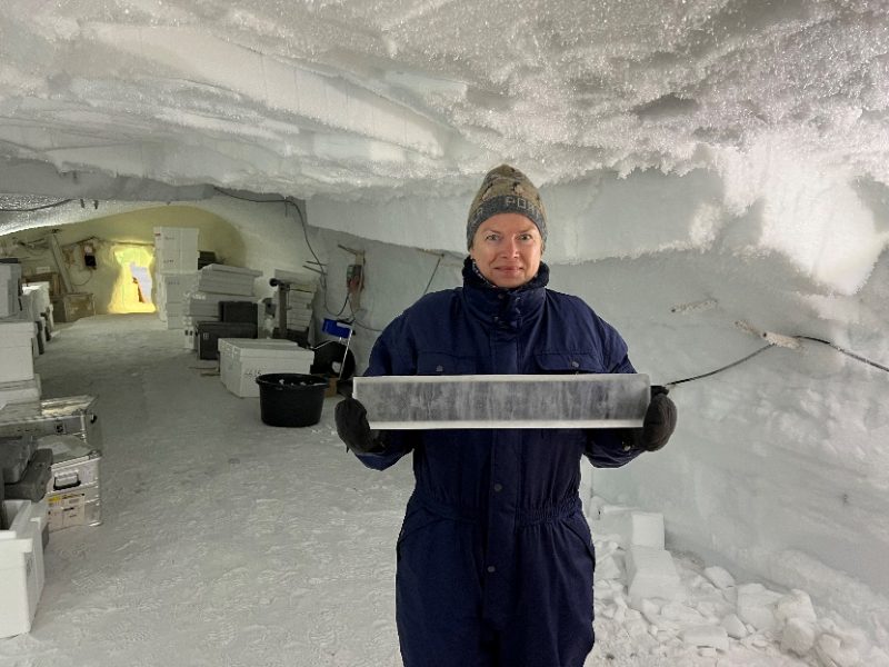 Bettina Ovgard Petersen, Senior Consultant Civil Military Cooperation, Science Liaison Officer, Joint Arctic Command of Denmark holding a 90,000 year old, 3 cm thick slab of ice core from the beginning of the ice age.