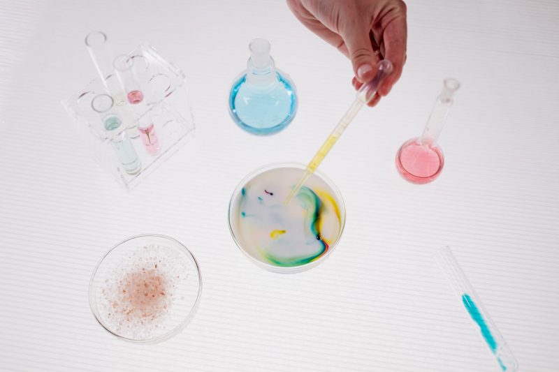a photo of a laboratory experiment on a glass with colours
