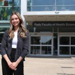 Student Alexa Pommer standing outside the Rady Faculty of Health Sciences Brodie Atrium.
