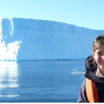 image of UM researcher Juliana Marson in front of a iceberg