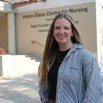Kali Froese stands outside the Helen Glass Centre for Nursing at Fort Garry Campus.