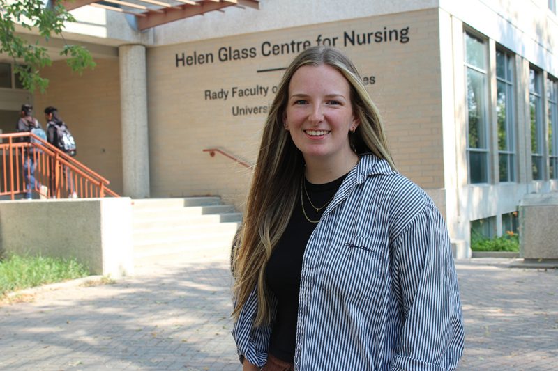 Kali Froese stands outside the Helen Glass Centre for Nursing at Fort Garry Campus.