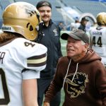 Bisons Kicker Maya Turner and Coach Brian Dobie at history-making game, where she became the first woman to play and score in Canadian U sports.