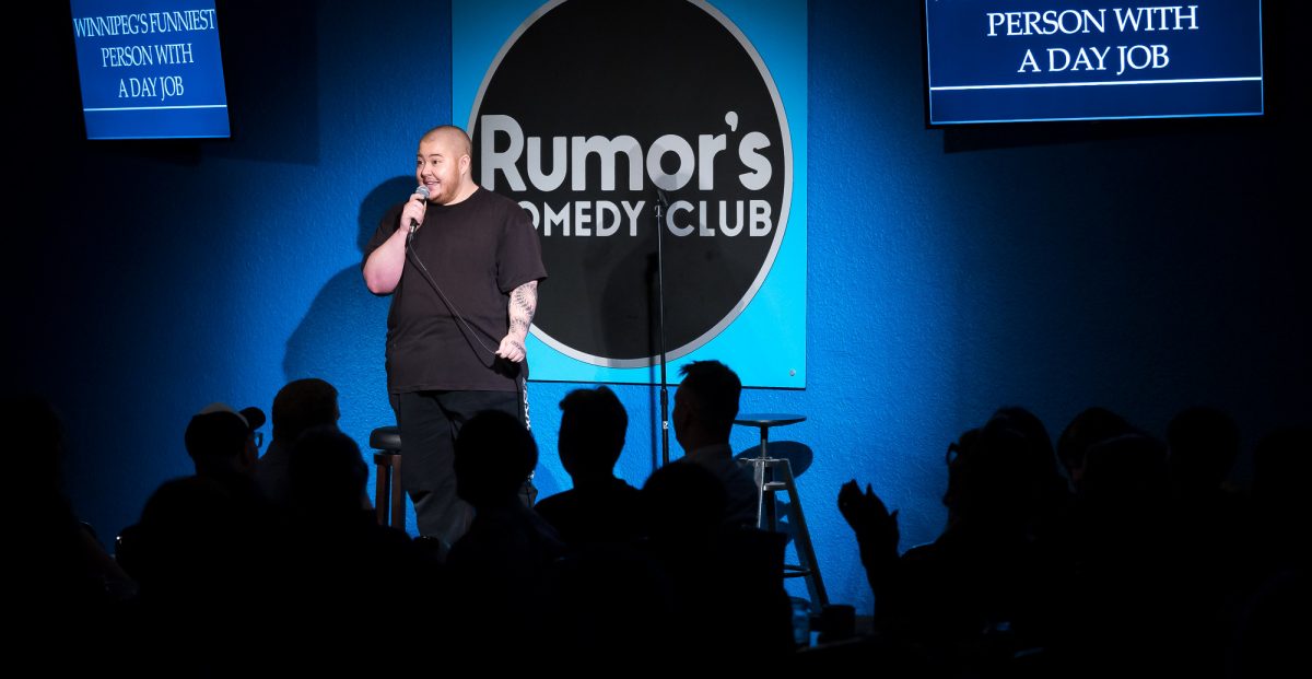 Law student Lou Lamari (3L) competes for the title of “Winnipeg’s Funniest Person with a Day Job” at Rumor’s Comedy Club.