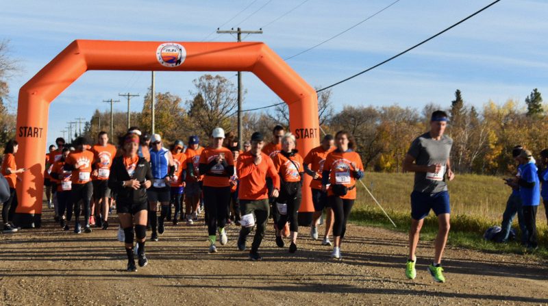 Runners take off from the starting line of the 2nd Annual Reconciliation Run, near the ruins of the former Birtle Residential School.