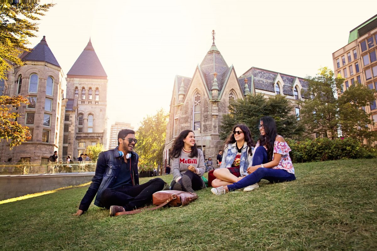 Student group sitting on "the beach" in front of Redpath Museum Valeria Lau | McGill University (April 2018)