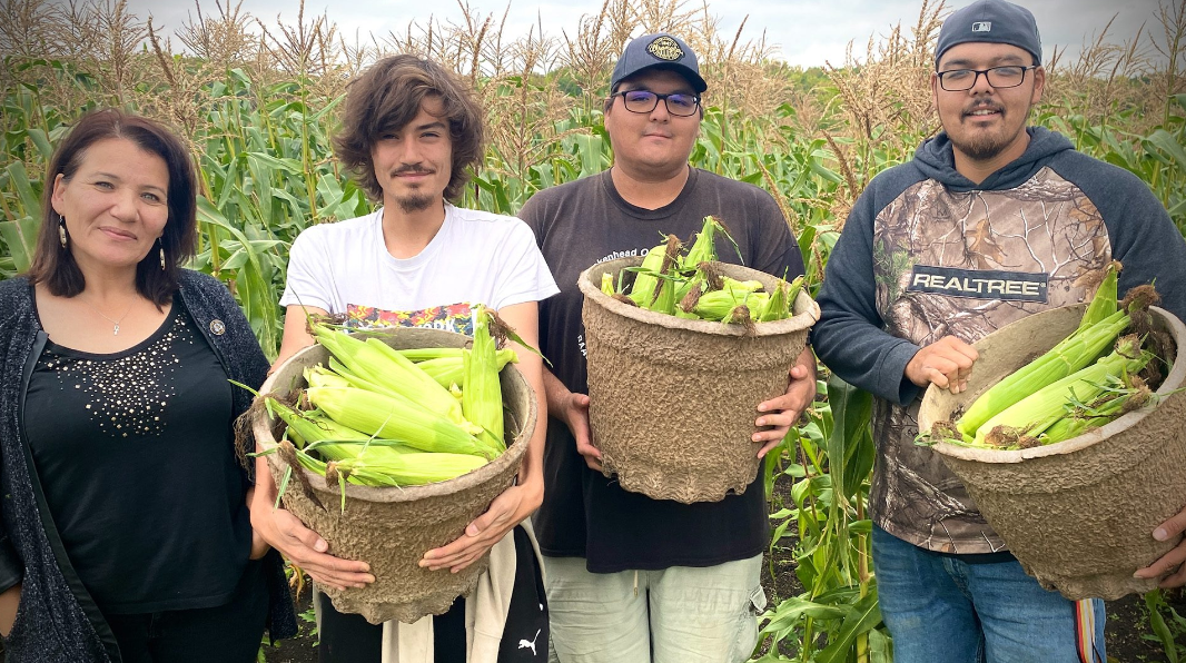 From the left, Brenda Greyeyes, Hayden Gilmour and Corey and Colin Pangman holding some of the fruits of their labour. Photo: Tamara Pimentel/APTN.