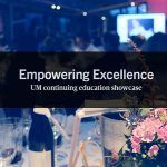 Photo of a table at a formal event, with wine bottle, flowers and Empowering Excellence UM continuing education showcase on it.
