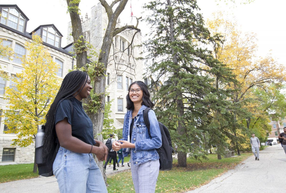 Students are photographed outside on a sunny day on the University of Manitoba's Fort Garry campus on September 19, 2019. (Photo by Marianne Helm / University of Manitoba)