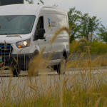 Image of UM electric vehicle driving through campus