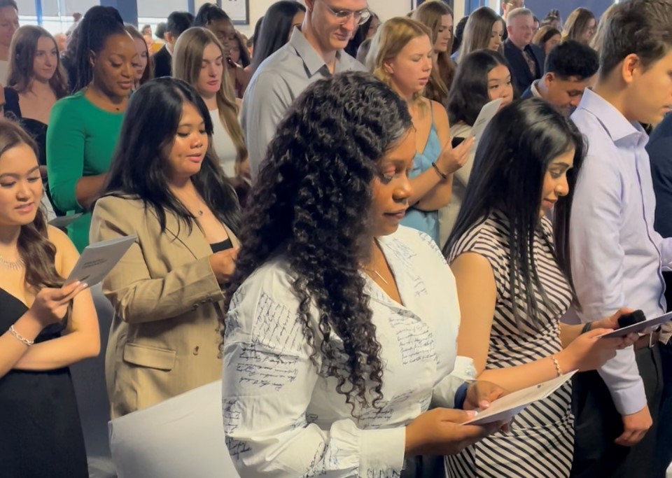 Nursing students reading the UM nursing pledge.