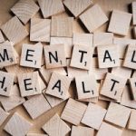 Scrabble tiles spelling out the word mental health