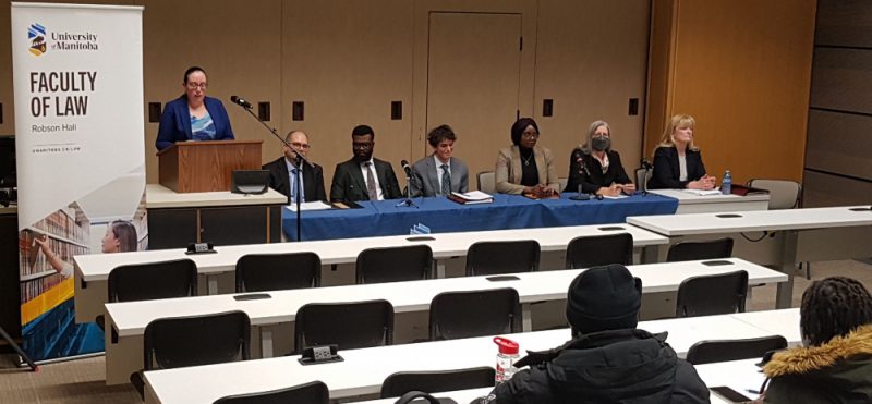Clinical Instructor Andrea Doyle (far left) introduces the Faculty of Law’s Access to Justice Week event panel for the Access to Justice in French: A World to Discover event. Left to right: Moderator Honourable Judge Denis Guenette, Jean-René Dominique Kwilu, Tarik Daoudi, Ruphine Djuissi, Dr. Lorna Turnbull, and Keynote speaker Chief Justice of Manitoba, Marianne Rivoalen.
