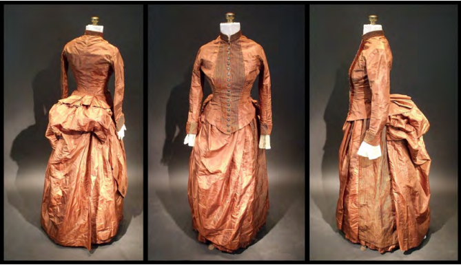 The Victorian-era silk dress containing coded messages in a hidden pocket. 