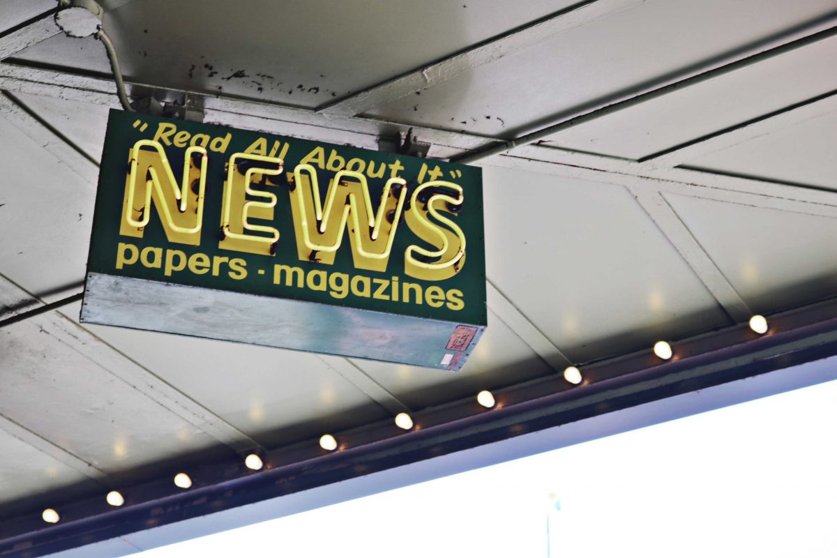 neon sign that reads, "Read all about it, NEWS"