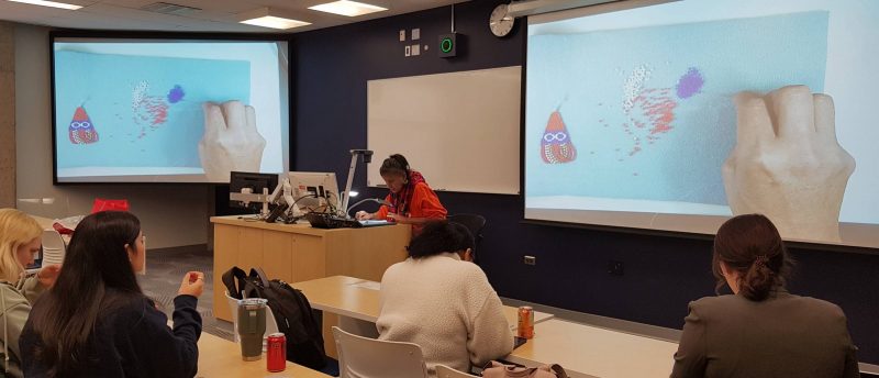 Elder Candace Volk teaches beading to law students and staff, making good use of a Robson Hall classroom document camera.
