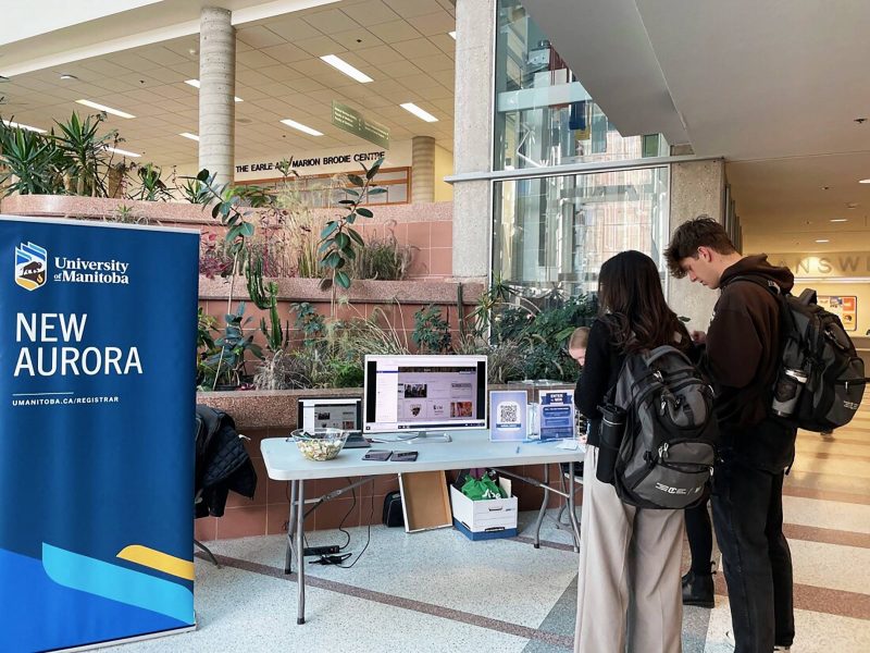 Students standing in front of a computer watching the new aurora video