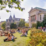 Students lounging on "the beach" in front of Redpath Museum. Valeria Lau | McGill University (April 2018)