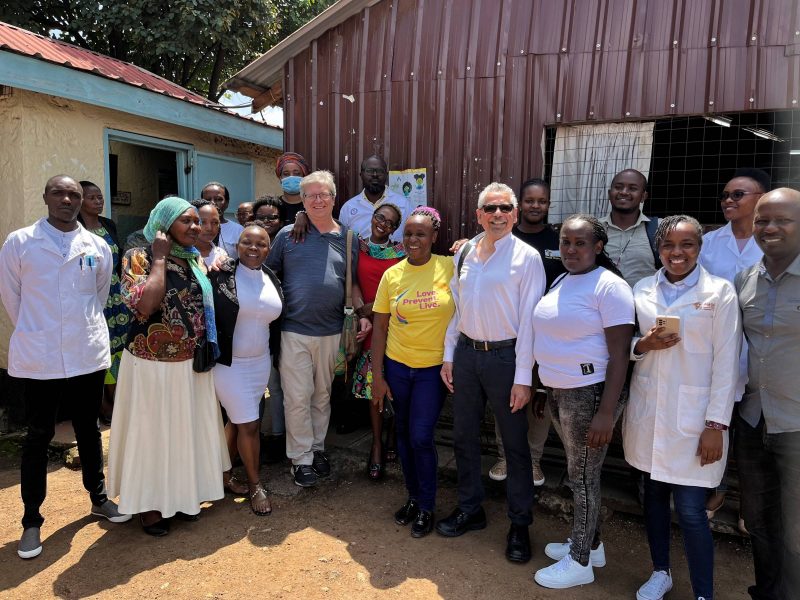Dr. Keith Fowke and Dr. Mario Pinto with patient cohort at Nairobi research clinic.