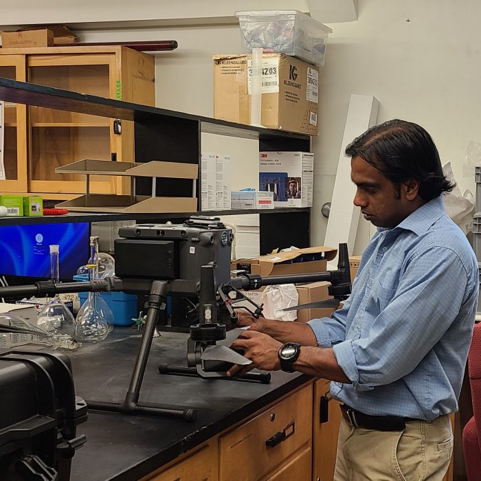 Dilshan Benaragama assembles a drone in the lab