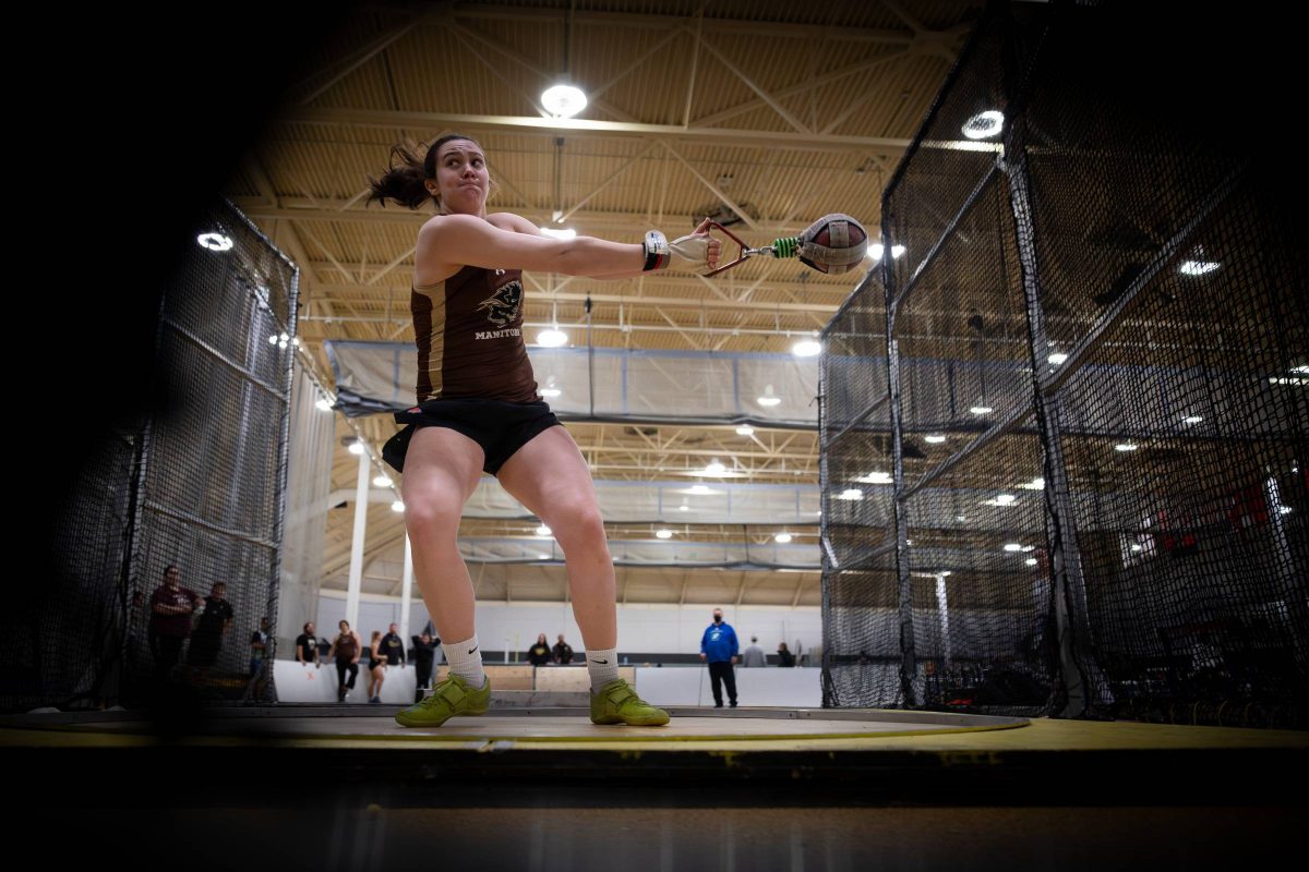 Anna McConnell mid throw during a weight throw competition