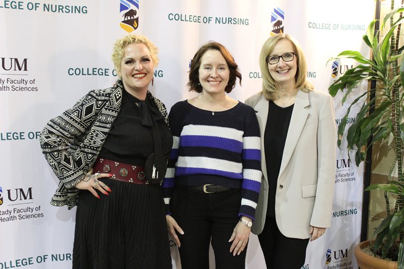 Stephanie Van Haute, Cindy Fehr and Lisa Merrill in front of a sign that reads "College of Nursing."